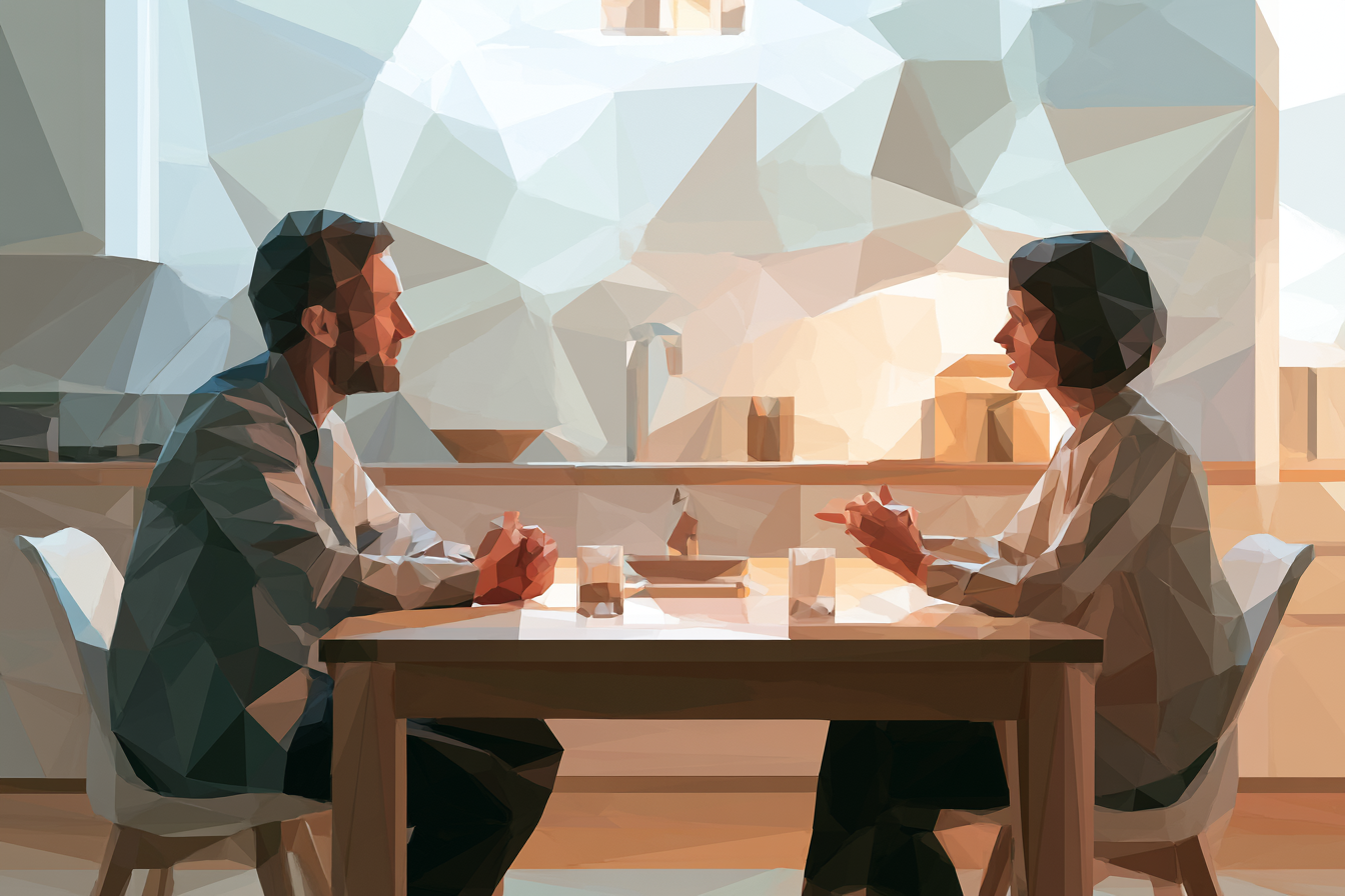 Two people speaking at a kitchen table